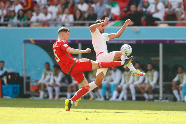 Wales v Iran 2022 FIFA World Cup, WM, Weltmeisterschaft, Fussball Joe Rodon of Wales clears from an Iranian player during the 2022 FIFA World Cup Group B match at Ahmad Bin Ali Stadium, Al-Rayyan Content Not Available For UK Newspapers Copyright: xPaulxChestertonx FIL-17643-0042 UK Newspapers OUT