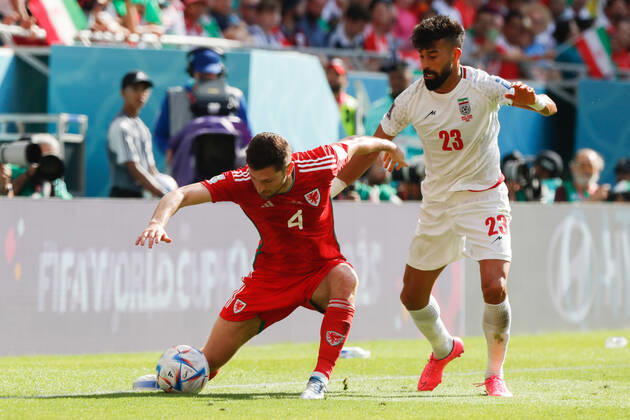 Wales v Iran 2022 FIFA World Cup, WM, Weltmeisterschaft, Fussball Ben Davies of Wales is challenged by Ramin Rezaeian of Iran during the 2022 FIFA World Cup Group B match at Ahmad Bin Ali Stadium, Al-Rayyan Content Not Available For UK Newspapers Copyright: xPaulxChestertonx FIL-17643-0063 UK Newspapers OUT