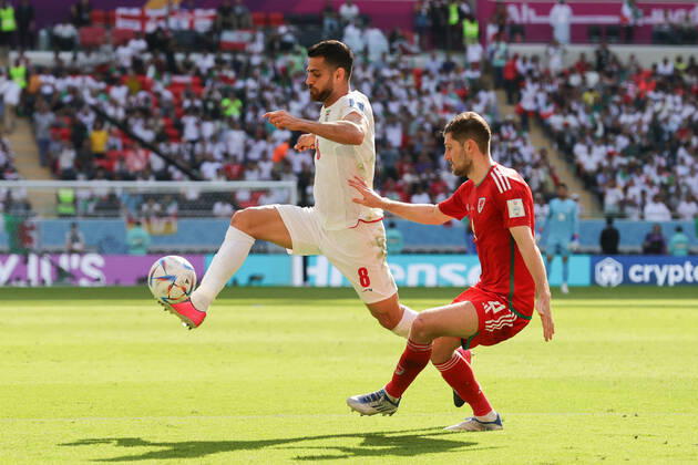 Wales v Iran 2022 FIFA World Cup, WM, Weltmeisterschaft, Fussball Morteza Pouraliganji of Iran controls the ball ahead of Ben Davies of Wales during the 2022 FIFA World Cup Group B match at Ahmad Bin Ali Stadium, Al-Rayyan Content Not Available For UK Newspapers Copyright: xPaulxChestertonx FIL-17643-0087 UK Newspapers OUT