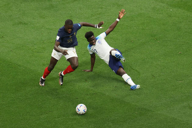 England v France : FIFA World Cup, WM, Weltmeisterschaft, Fussball 10 December 2022, Al Kohr - FIFA World Cup Qatar 2022 - Quarter-Finals - England v France - Dayot Upamecano of France and Bukayo Saka of England - Photo: Charlotte Wilson Offside. Al Kohr Qatar Copyright: xCharlottexWilsonx xOffsidexOffside