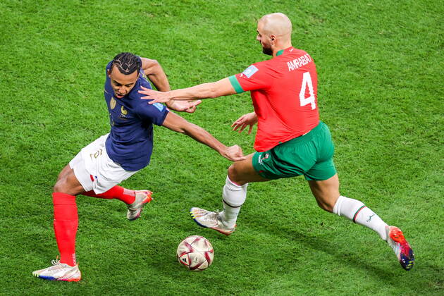 QATAR, AL KHOR - DECEMBER 14, 2022: France s Jules Kounde (L) and Morocco s Sofyan Amrabat in action in their 2022 FIFA World Cup, WM, Weltmeisterschaft, Fussball semi-final football match at Al-Bayt Stadium. Sergei Bobylev TASS  56419892