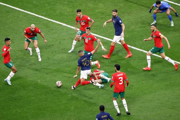 Football World Cup in Qatar France s Kylian Mbappe (10) battles with Morocco defenders during the first half a World Cup semifinal football match at Al-Bayt Stadium in Al Khor, Qatar, on Dec. 14, 2022.  A14AA0001376019P 