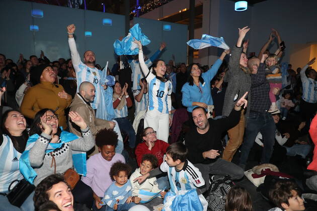 Illustration picture shows fans of Argentina cheering, as they gather to watch a soccer game between France and Argentina, the final of the FIFA 2022 World Cup, at The Football Village Brussels , organised at Autoworld car museum, in Brussels on Sunday 18 December 2022. NICOLASxMAETERLINCK  x56770638x
