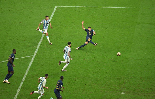 (221218) -- LUSAIER, Dec. 18, 2022 -- Kylian Mbappe (1st R) of France scores a goal during the Final between Argentina and France at the 2022 FIFA World Cup, WM, Weltmeisterschaft, Fussball at Lusail Stadium in Lusail, Qatar, Dec. 18, 2022. ) (SP)QATAR-LUSAIL-2022 WORLD CUP-FINAL-ARG VS FRA XiaoxYijiu 