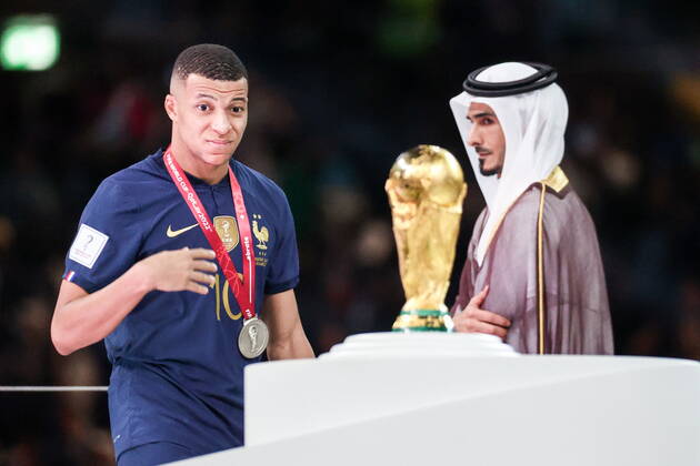 QATAR, LUSAIL - DECEMBER 18, 2022: France captain Kylian Mbappe (L) is seen during the trophy ceremony for the 2022 FIFA World Cup, WM, Weltmeisterschaft, Fussball final football match between Argentina and France at Lusail Iconic Stadium. Argentina won 3-3 (4-2) in a penalty shootout. Sergei Bobylev TASS  56487383
