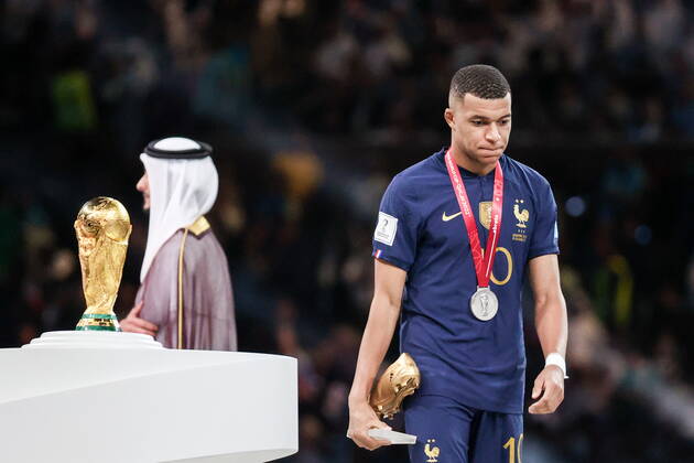 QATAR, LUSAIL - DECEMBER 18, 2022: France captain Kylian Mbappe (R) is seen during the trophy ceremony for the 2022 FIFA World Cup, WM, Weltmeisterschaft, Fussball final football match between Argentina and France at Lusail Iconic Stadium. Argentina won 3-3 (4-2) in a penalty shootout. Sergei Bobylev TASS  56487384