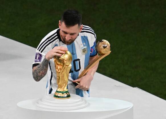 Qatar Soccer World Cup Argentina - France 8342442 18.12.2022 Argentina s Lionel Messi celebrates celebrates the victory during the award ceremony following the Qatar 2022 World Cup final match between Argentina and France at the Lusail Iconic Stadium, in Lusail, Qatar. Grigory Sysoev Sputnik Lusail Qatar  Copyright: xGrigoryxSysoevx