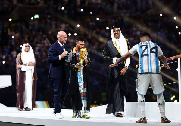 Mandatory Credit: Photo by Kieran McManus Shutterstock (13670809hm) Lionel Messi with the World Cup trophy after Argentina win the World Cup with FIFA President Gianni Infantino and Sheikh Tamim bin Hamad Al Thani Argentina v France, FIFA World Cup, WM, Weltmeisterschaft, Fussball 2022, Final, Football, Lusail Stadium, Al Daayen, Qatar - 18 Dec 2022 Editorial Use Only Argentina v France, FIFA World Cup 2022, Final, Football, Lusail Stadium, Al Daayen, Qatar - 18 Dec 2022 Editorial Use Only Copyright: xKieranxMcManus Shutterstockx 13670809hm