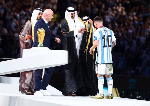 Mandatory Credit: Photo by Kieran McManus Shutterstock (13670809hw) Lionel Messi is given piece of clothing by Sheikh Tamim bin Hamad Al Thani and FIFA President Gianni Infantino and after Argentina win the World Cup Argentina v France, FIFA World Cup, WM, Weltmeisterschaft, Fussball 2022, Final, Football, Lusail Stadium, Al Daayen, Qatar - 18 Dec 2022 Editorial Use Only Argentina v France, FIFA World Cup 2022, Final, Football, Lusail Stadium, Al Daayen, Qatar - 18 Dec 2022 Editorial Use Only Copyright: xKieranxMcManus Shutterstockx 13670809hw