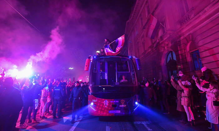 Croatia team victory parade Domagoj Vida of Croatia waves with Croatia flag during the Croatia team victory parade at Ban Jelacic square (following their victory over Morocco in the 2022 FIFA World Cup, WM, Weltmeisterschaft, Fussball bronze medal match the previous day) on December 18, 2022 in Zagreb, Croatia. MarkoxLukunic PIXSELL