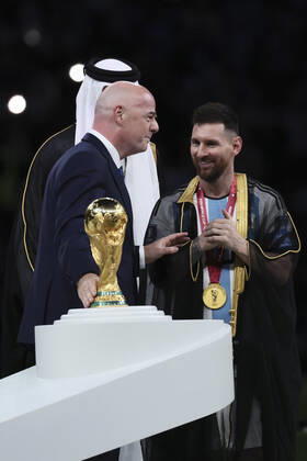(221218) -- LUSAIL, Dec. 18, 2022 -- FIFA President Gianni Infantino (L) awards Lionel Messi (R) of Argentina during the awarding ceremony of the 2022 FIFA World Cup, WM, Weltmeisterschaft, Fussball at Lusail Stadium in Lusail, Qatar, Dec. 18, 2022. ) (SP)QATAR-LUSAIL-2022 WORLD CUP-FINAL-ARG VS FRA LanxHongguang
