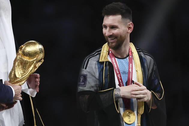 (221218) -- LUSAIL, Dec. 18, 2022 -- Lionel Messi (R) of Argentina looks at the World Cup Trophy during the awarding ceremony of the 2022 FIFA World Cup, WM, Weltmeisterschaft, Fussball at Lusail Stadium in Lusail, Qatar, Dec. 18, 2022. ) (SP)QATAR-LUSAIL-2022 WORLD CUP-FINAL-ARG VS FRA LanxHongguang 