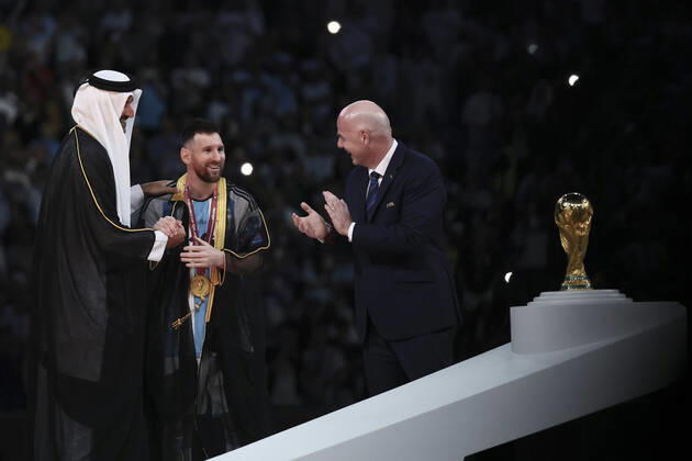 (221218) -- LUSAIL, Dec. 18, 2022 -- FIFA President Gianni Infantino (R) and The Emir of Qatar Sheikh Tamim bin Hamad Al Thani (L) award Lionel Messi of Argentina during the awarding ceremony of the 2022 FIFA World Cup, WM, Weltmeisterschaft, Fussball at Lusail Stadium in Lusail, Qatar, Dec. 18, 2022. ) (SP)QATAR-LUSAIL-2022 WORLD CUP-FINAL-ARG VS FRA LanxHongguang 
