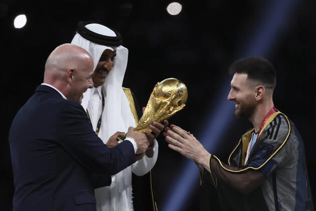 (221218) -- LUSAIL, Dec. 18, 2022 -- FIFA President Gianni Infantino (L) and The Emir of Qatar Sheikh Tamim bin Hamad Al Thani (C) award Lionel Messi of Argentina during the awarding ceremony of the 2022 FIFA World Cup, WM, Weltmeisterschaft, Fussball at Lusail Stadium in Lusail, Qatar, Dec. 18, 2022. ) (SP)QATAR-LUSAIL-2022 WORLD CUP-FINAL-ARG VS FRA LanxHongguang