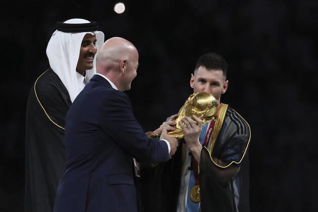 (221218) -- LUSAIL, Dec. 18, 2022 -- FIFA President Gianni Infantino (C) awards Lionel Messi (R) of Argentina during the awarding ceremony of the 2022 FIFA World Cup, WM, Weltmeisterschaft, Fussball at Lusail Stadium in Lusail, Qatar, Dec. 18, 2022. ) (SP)QATAR-LUSAIL-2022 WORLD CUP-FINAL-ARG VS FRA LanxHongguang