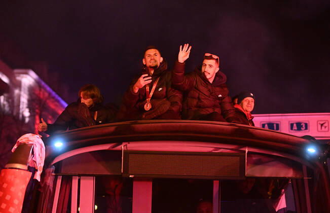 Croatia victory parade Domagoj Vida of Croatia waves with Croatia flag during the Croatia team victory parade at Ban Jelacic square (following their victory over Morocco in the 2022 FIFA World Cup, WM, Weltmeisterschaft, Fussball bronze medal match the previous day) on December 18, 2022 in Zagreb, Croatia. MarkoxLukunic PIXSELL