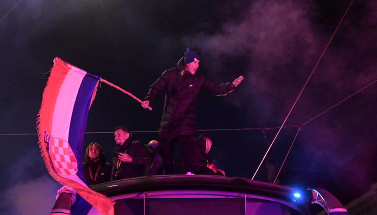 Croatia victory parade Domagoj Vida of Croatia waves with Croatia flag during the Croatia team victory parade at Ban Jelacic square (following their victory over Morocco in the 2022 FIFA World Cup, WM, Weltmeisterschaft, Fussball bronze medal match the previous day) on December 18, 2022 in Zagreb, Croatia. MarkoxLukunic PIXSELL