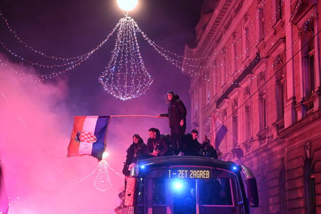 Croatia victory parade Domagoj Vida of Croatia waves with Croatia flag during the Croatia team victory parade at Ban Jelacic square (following their victory over Morocco in the 2022 FIFA World Cup, WM, Weltmeisterschaft, Fussball bronze medal match the previous day) on December 18, 2022 in Zagreb, Croatia. MarkoxLukunic PIXSELL