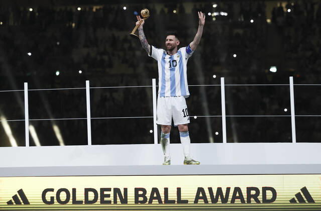 (221218) -- LUSAIER, Dec. 18, 2022 -- Lionel Messi of Argentina celebrates his golden ball award during the awarding ceremony of the 2022 FIFA World Cup, WM, Weltmeisterschaft, Fussball at Lusail Stadium in Lusail, Qatar, Dec. 18, 2022. ) (SP)QATAR-LUSAIL-2022 WORLD CUP-FINAL-ARG VS FRA LixMing 