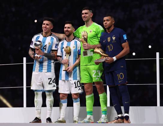 Doha, Qatar, 18th December 2022. Enzo Fernandez of Argentina Young player of the Tournament, Lionel Messi of Argentina Player of the Tournament, Emiliano Martinez of Argentina Golden Glove winner and Kylan Mbappe of France Golden Boot winner during the FIFA World Cup, WM, Weltmeisterschaft, Fussball 2022 match at Lusail Stadium, Doha. Picture credit should read: David Klein Sportimage EDITORIAL USE ONLY. No use with unauthorised audio, video, data, fixture lists, club league logos or live services. Online in-match use limited to 120 images, no video emulation. No use in betting, games or single club league player publications. SPI-2101-0257