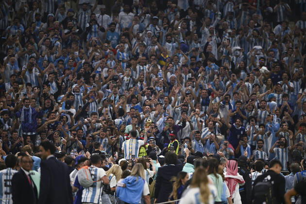 (221218) -- LUSAIER, Dec. 18, 2022 -- Lionel Messi of Argentina celebrates with the trophy in front of the fans after winning the Final between Argentina and France at the 2022 FIFA World Cup, WM, Weltmeisterschaft, Fussball at Lusail Stadium in Lusail, Qatar, Dec. 18, 2022. ) (SP)QATAR-LUSAIL-2022 WORLD CUP-FINAL-ARG VS FRA LixGa