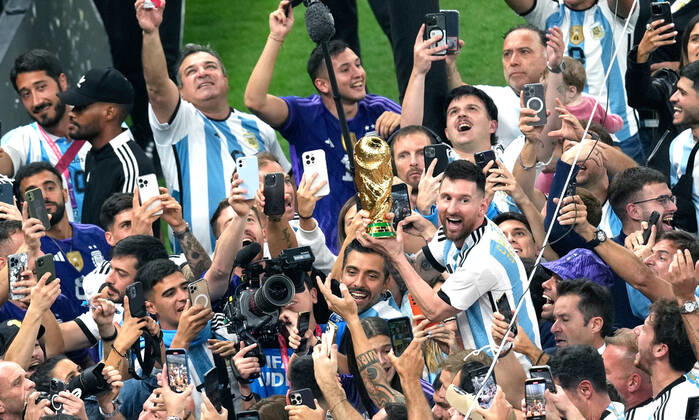 (221218) -- LUSAIL, Dec. 18, 2022 -- Lionel Messi of Argentina celebrates with the World Cup Trophy after the awarding ceremony of the 2022 FIFA World Cup, WM, Weltmeisterschaft, Fussball at Lusail Stadium in Lusail, Qatar, Dec. 18, 2022. ) (SP)QATAR-LUSAIL-2022 WORLD CUP-FINAL-ARG VS FRA PanxYulong