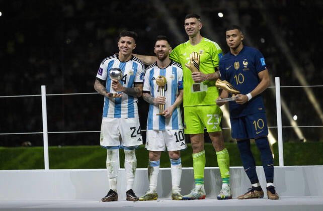 Doha, Qatar. 18th Dec, 2022. Enzo Fernandez best young player, Lionel Messi best player, Goalkeeper Emiliano Martinez of Argentina best goalkeeper and Kylian MbappÃ of France won the Golden Boot award during he FIFA World Cup, WM, Weltmeisterschaft, Fussball Qatar 2022 Final match Argentina - France Final Match Argentinien - Frankreich World Cup 2022 in Qatar 18.12.2022