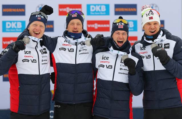 BIATHLON - IBU WC Oberhof OBERHOF,GERMANY,19.FEB.23 - BIATHLON - IBU World Championships 2023, 4x7.5 km relay, men, award ceremony. Image shows the rejoicing of Johannes Thingnes Boe, Tarjei Boe, Sturla Holm Laegreid and Vetle Sjaastad Christiansen (NOR). Keywords: medal.  GEPAxpictures xThomasxBachun