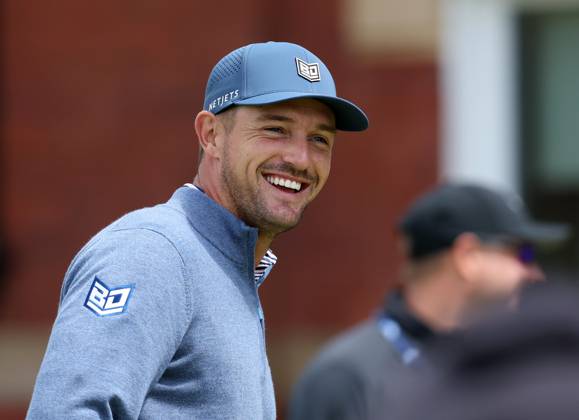 17th July 2023; Royal Liverpool Golf Club, Hoylake, Merseyside, England: The Open Championship Practice Day; Bryson Dechambeau (USA) smiles as he practices on the putting green in front of the clubhouse  ActionPlus12532358 DavidxBlunsden