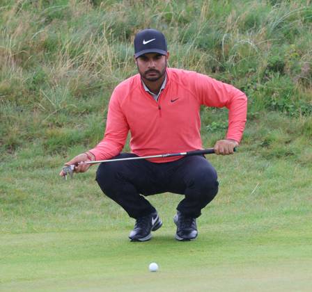 Indian Shubhankar Sharma lines up a putt on the eleventh green on the third day at the 151st Open Championship at Royal Liverpool Golf Club in Hoylake, England on Saturday, July 22, 2023.  LON2023072245 HUGOxPHILPOTT