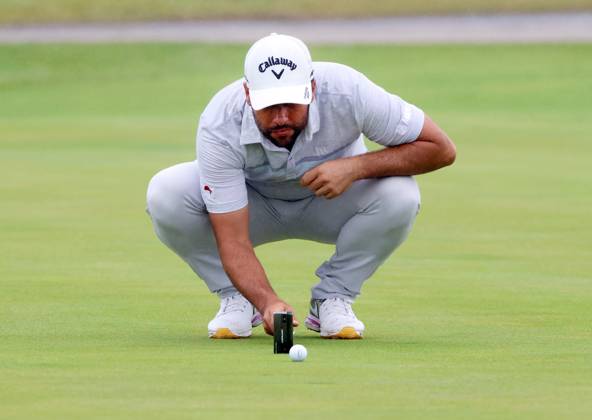 Spain s Adrian Otaegui lines up a putt on the eigth green on the third round at the 151st Open Championship at Royal Liverpool Golf Club in Hoylake, England on Saturday, July 22, 2023.  LON2023072265 HUGOxPHILPOTT