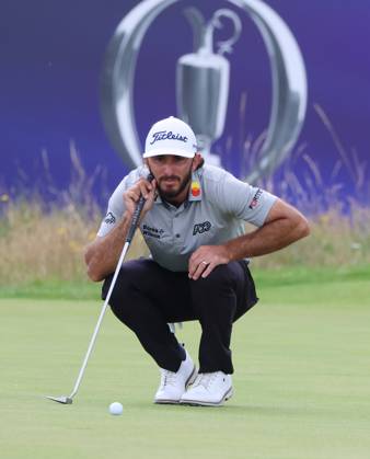 American Max Homa lines up a putt on the third green on the third day at the 151st Open Championship at Royal Liverpool Golf Club in Hoylake, England on Saturday, July 22, 2023.  LON2023072210 HUGOxPHILPOTT