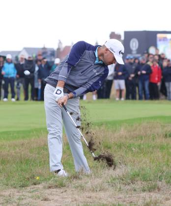 American Brian Harman plays out of the rough on the fourth hole on the third day at the 151st Open Championship at Royal Liverpool Golf Club in Hoylake, England on Saturday, July 22, 2023.  LON2023072226 HUGOxPHILPOTT