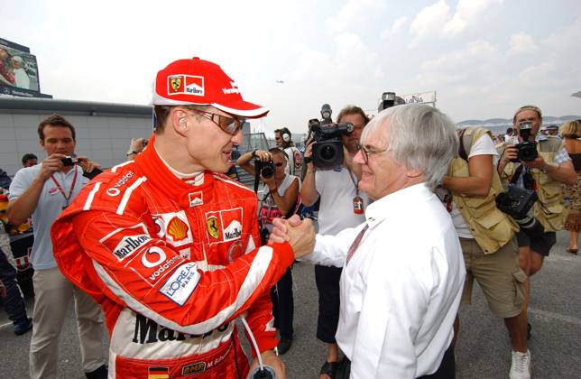 Malaysian Formula One Grand Prix German Formula 1 driver Michael Schumacher (team Ferrari) with Bernie Ecclestone President FOM during Fernando Alonso 1st, Jarno Trulli 2nd, Nick Heidfeld 3rd at the Malaysian Formula One Grand Prix, Sepang Circuit, Kuala Lumpur, Malaysia, March 20, 2005. Photo by Thierry Gromik ABACA Kuala Lumpur Malaysia  Copyright: xGromikxThierry ABACAx 75168_17 GromikxThierry ABACAx 75168_17