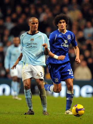 Vincent Kompany of Manchester City and Marouane Fellaini of Everton Vincent Kompany of Manchester City and Marouane Fellaini of Everton..Barclays Premier League..Manchester City v Everton..13th December, 2008..--------------------..Sportimage +44 Image: PHOTOGRAPHER Cal Media) UK EDITORIAL USE ONLY Copyright: xx SimonxBellisx csmphoto160425