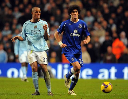 Vincent Kompany of Manchester City and Marouane Fellaini of Everton Vincent Kompany of Manchester City and Marouane Fellaini of Everton..Barclays Premier League..Manchester City v Everton..13th December, 2008..--------------------..Sportimage +44 Image: PHOTOGRAPHER Cal Media) UK EDITORIAL USE ONLY Copyright: xx SimonxBellisx csmphoto160566