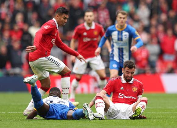 Brighton and Hove Albion v Manchester United, ManU - The FA Cup - Semi-Final - Wembley Stadium April 23, 2023, London: London, England, 23rd April 2023. Moises Caicedo of Brighton and Hove Albion and Bruno Fernandes of Manchester United on the floor after battling for the ball during the The FA Cup match at Wembley Stadium, London. London EDITORIAL USE ONLY Copyright: xx ZUMA-20230423_zaf_si1_019.jpg KieranxCleevesx csmphotothree088388