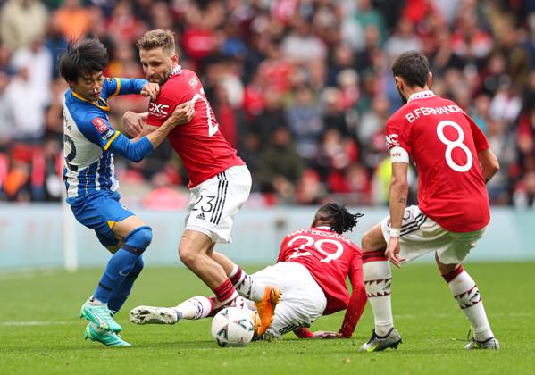 Brighton and Hove Albion v Manchester United, ManU - The FA Cup - Semi-Final - Wembley Stadium April 23, 2023, London: London, England, 23rd April 2023. Karol Mitoma of Brighton and Hove Albion, Luke Shaw of Manchester United, Aaron Wan-Bissaka of Manchester United and Bruno Fernandes of Manchester United (left to right) battle for the ball during the The FA Cup match at Wembley Stadium, London. London EDITORIAL USE ONLY Copyright: xx ZUMA-20230423_zaf_si1_016.jpg KieranxCleevesx csmphotothree088389