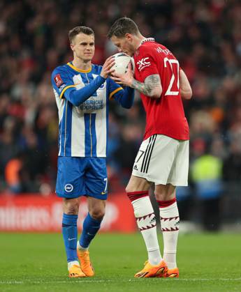 Brighton and Hove Albion v Manchester United, ManU - The FA Cup - Semi-Final - Wembley Stadium April 23, 2023, London: London, England, 23rd April 2023. Wout Weghorst of Manchester United (right) gives the ball to Solly March of Brighton and Hove Albion (left) before his missed penalty in the shootout during the The FA Cup match at Wembley Stadium, London. London EDITORIAL USE ONLY Copyright: xCalxSportxMediax ZUMA-20230423_zaf_si1_072.jpg KieranxCleevesx csmphotothree088491