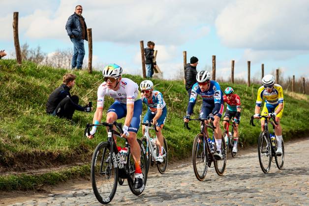 French Thomas Gachignard of TotalEnergies, German Niklas Markl of Team DSM-Firmenich PostNL, Danish Casper Pedersen of Soudal Quick-Step and Belgian Victor Vercouillie of Team Flanders Baloise pictured in action during the men elite race of the Dwars Door Vlaanderen cycling race, 188,6 km from Roeselare to Waregem, Wednesday 27 March 2024. DAVIDxPINTENS x89927474x