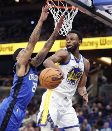 March 27, 2024, Orlando, FL - Florida, USA: The Golden State Warriors Andrew Wiggins, right, passes around the Orlando Magic s Markelle Fultz at the Kia Center on Wednesday, March 27, 2024, in Orlando, Florida. Orlando USA - ZUMAm67_ 0442592973st Copyright: xStephenxM.xDowellx