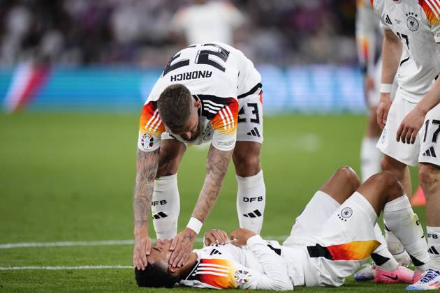 Germany v Scotland: Group A - UEFA EURO, EM, Europameisterschaft,Fussball 2024 Jamal Musiala attacking midfield of Germany and Bayern Munich lies injured on the pitch during the UEFA EURO 2024 group stage match between Germany and Scotland at Munich Football Arena on June 14, 2024 in Munich, Germany. Munich Germany Copyright: xJosexBretonx originalFilename:breton-germanyv240614_nposb