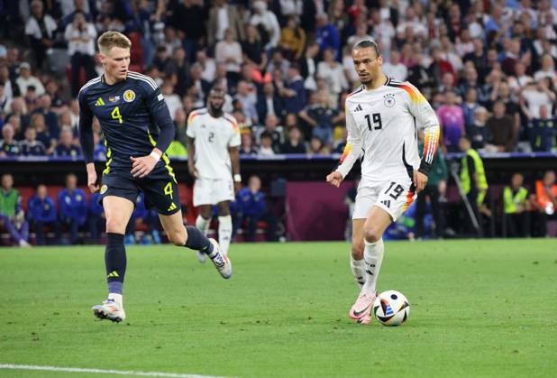 14.06.2024, Fussball, Herren, UEFA Europameisterschaft 2024, Eröffnungsspiel, Gruppe A, Deutschland - Schottland, Leroy Sane (Deutschland), Scott McTominay (Schottland) München Allianz Arena Bayern Deutschland (DE) Copyright: xSebastianxBachx