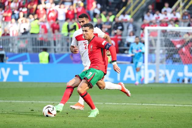 Germany - UEFA EURO, EM, Europameisterschaft,Fussball 2024 - Turkey vs Portugal - 15 06 2024 GERMANY, DORTMUND, JUNE 22. Cristiano Ronaldo of Portugal kicks the ball under pressure from Zeki Celik of Turkey during the UEFA EURO 2024 group F stage match between Turkey and Portugal, on June 22, 2024 at BVB Stadion in Dortmund, Germany. Photo by Manuel Blondeau AOP.Press Dortmund BVB Stadion Germany Copyright: x ManuelxBlondeau AOP.Pressx AOP20240622 0019