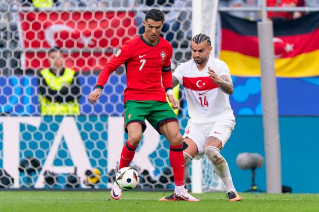 2024-06-22 Turkiye v Portugal - Group F - UEFA EURO, EM, Europameisterschaft,Fussball 2024 DORTMUND, GERMANY - JUNE 22: Cristiano Ronaldo of Portugal battles for the ball with Semih Kilicsoy of Turkiye during the Group F - UEFA EURO 2024 match between Turkiye and Portugal at BVB Stadion Dortmund on June 22, 2024 in Dortmund, Germany. (Photo by Joris Verwijst BSR Agency) Dortmund Germany Content not available for redistribution in The Netherlands directly or indirectly through any third parties. Copyright: xBSRxAgencyx