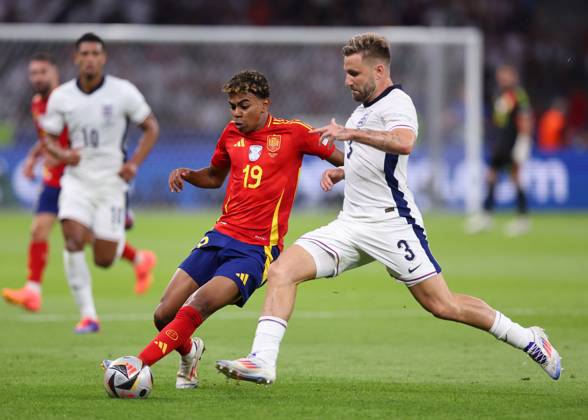 Berlin, Germany, 14th July 2024. Lamine Yamal of Spain tackled by Luke Shaw of England during the UEFA European Championships final match at Olympiastadion, Berlin. Picture credit should read: David Klein Sportimage EDITORIAL USE ONLY. No use with unauthorised audio, video, data, fixture lists, club league logos or live services. Online in-match use limited to 120 images, no video emulation. No use in betting, games or single club league player publications. SPI-3228-0079