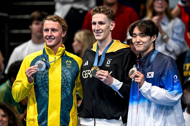 Elijah Winnington of Australia, silver, Lukas Martens of Germany, gold, Woomin Kim of Korea, bronze, show the medals after competing in the swimming 400m Freestyle Men Final during the Paris 2024 Olympic Games, Olympische Spiele, Olympia, OS at La Defense Arena in Paris (France), July 27, 2024. Giorgio Scala
