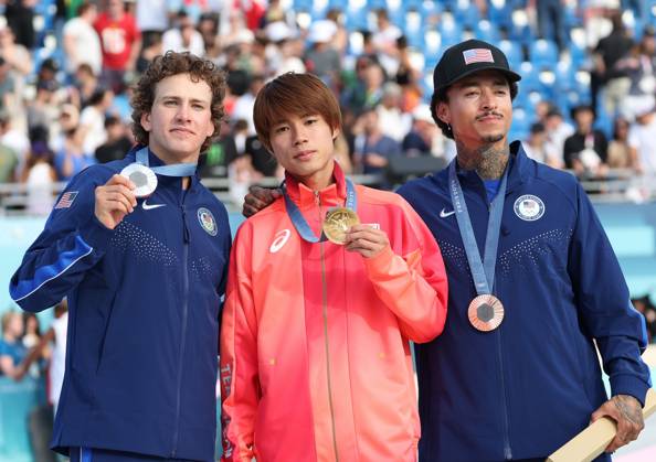 Japan s Yuto Horigome (C) and (L) Jagger Easton and (R) Nyjah Houston pose with their medals after the Men s Street Skateboard final at Place De La Concorde on the third day of the Paris Olympics on Monday, July 29, 2024. Japan s Horigome won the gold medal with USA s Eaton (L) and Huston (R)in silver and bronze medals  OLY20240729932 HUGOxPHILPOTT