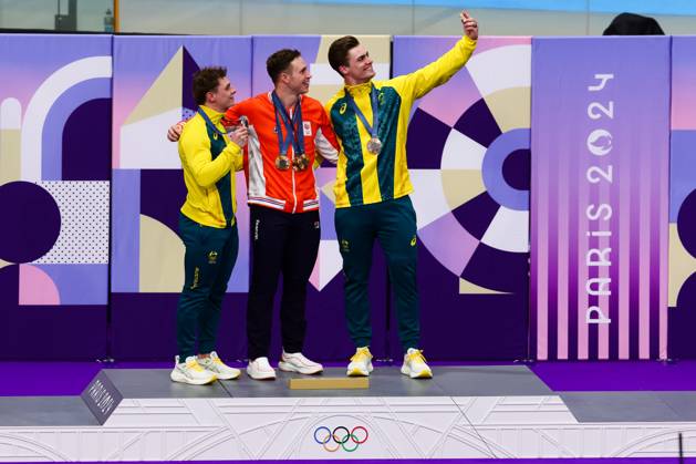 PARIS, FRANCE - AUGUST 11: Harrie Lavreysen of Team Netherlands takes a selfie after winning Gold on the Podium with Matthew Glaetzer of Team Australia and Matthew Richardson of Team Australia in the Men™s Keirin Final during the Cycling Track Paris 2024 Olympic Games, Olympische Spiele, Olympia, OS at the National Veladrome on August 11, 2024 in Paris, France. (Photo by Pete Dovgan Speed Media Icon Sportswire) OLYMPICS: AUG 11 Paris 2024 EDITORIAL USE ONLY Icon2408110212