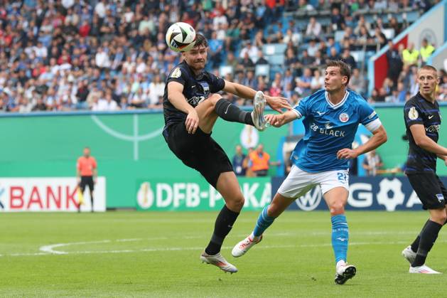 18.08.2024, xtgx, Fussball DFB Pokal 1. Runde, FC Hansa Rostock - Hertha BSC Berlin emspor, v.l. Linus Gechter (Hertha, 44), Alexander Rossipal (Rostock, 21) Zweikampf, Duell, Kampf, tackle (DFL DFB REGULATIONS PROHIBIT ANY USE OF PHOTOGRAPHS as IMAGE SEQUENCES and or QUASI-VIDEO) Rostock